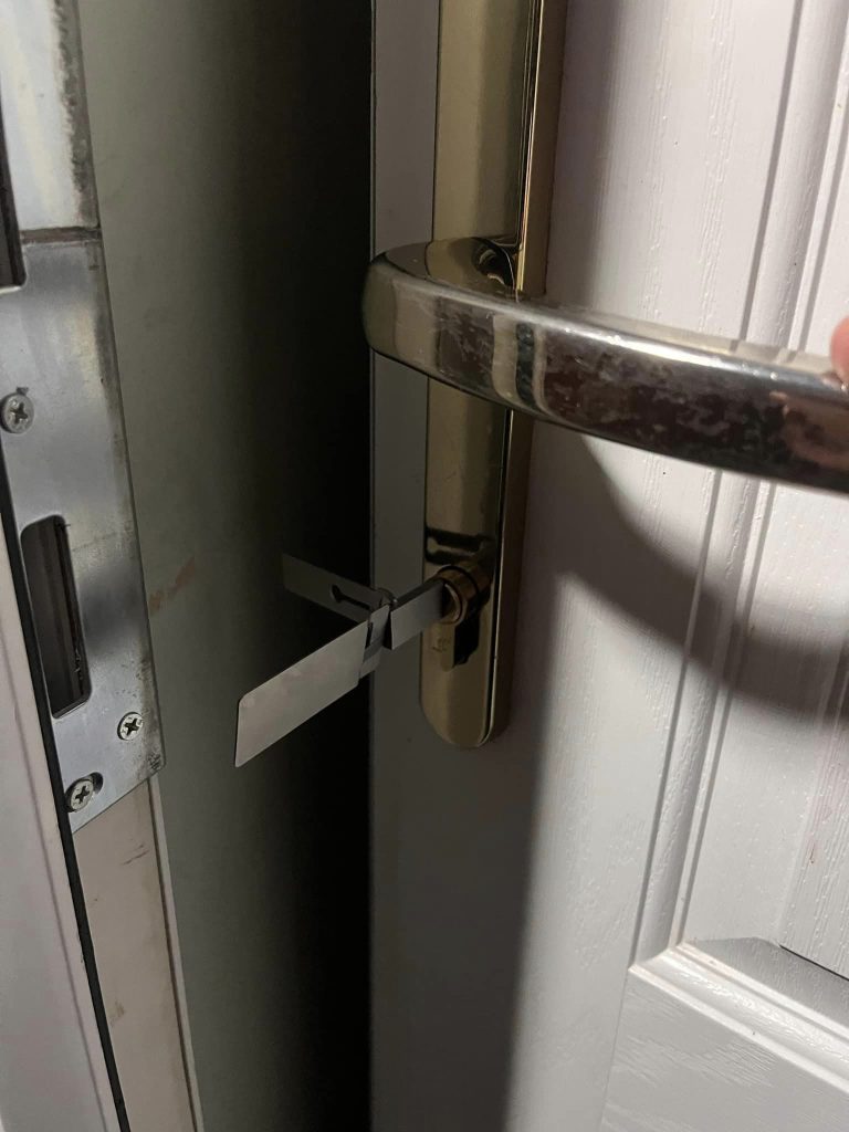 Picking a front door lock for a customer.